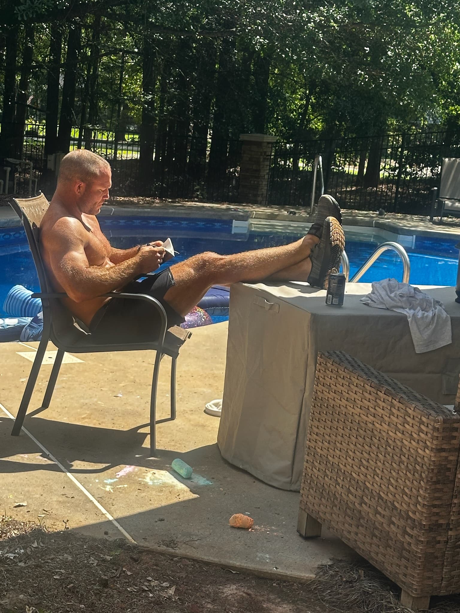 Chris reading in a chair